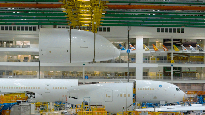 Sections of the enhanced 787-9 are loaded into Final Assembly.