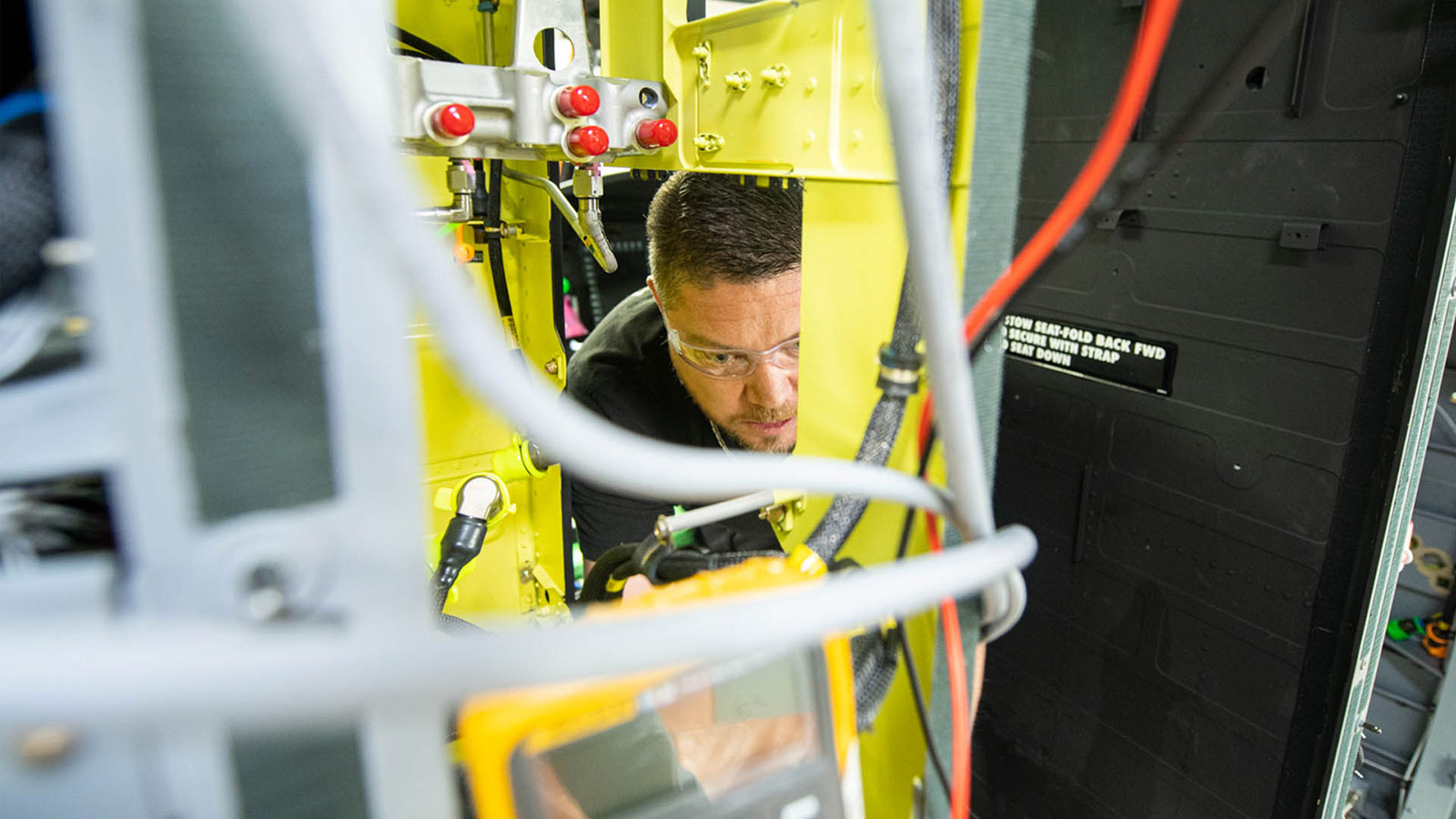 A Boeing Philadelphia teammate installs the first Active Parallel Actuator System on a Chinook aircraft. (© Boeing)