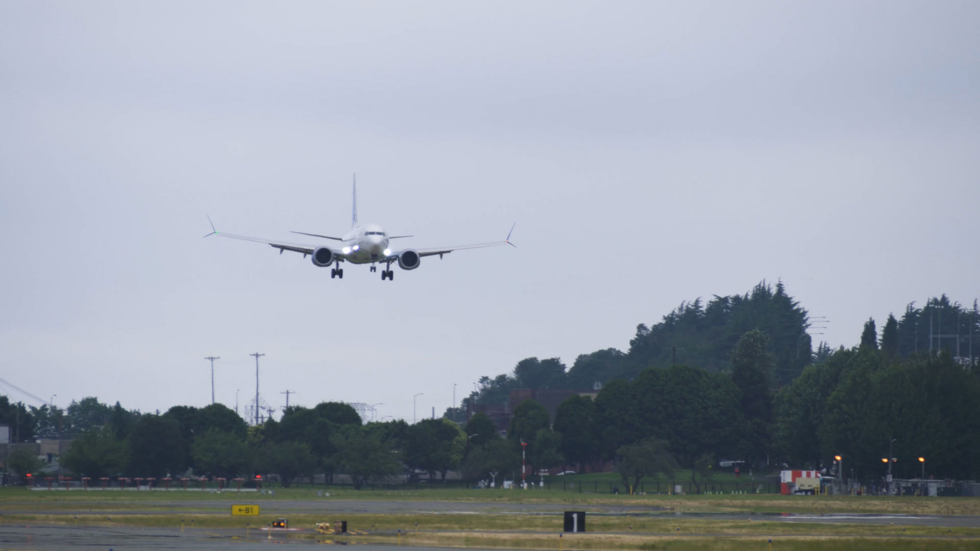 737-10 test airplane 1G003 lands at North Boeing Field in Seattle after its final planned certification flight.