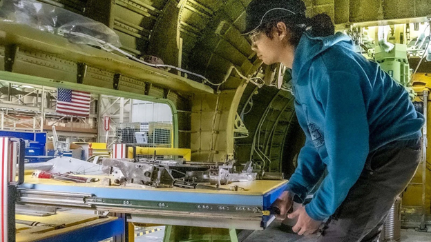 Boeing employee using slide-in cart